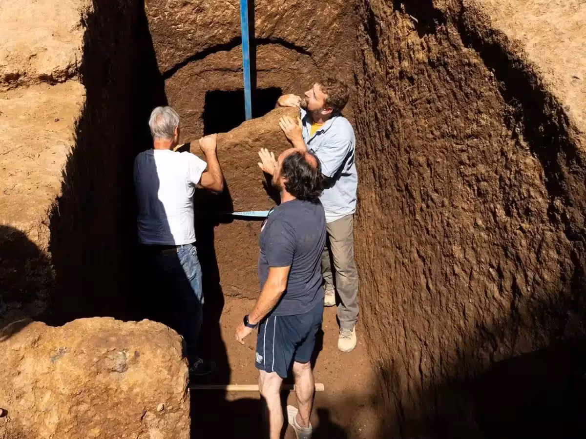 Archaeologists Carefully Lift The Stone Blocking A 2,600 Year Old Etruscan Tomb