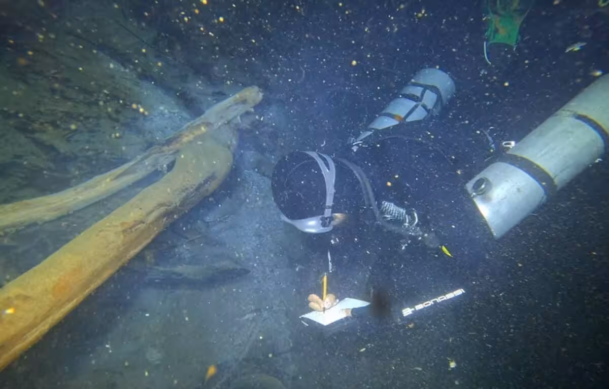 A Diver Surveys Archaeological Remains Inside Cenote Yaakun Near Playa Del Carmen.