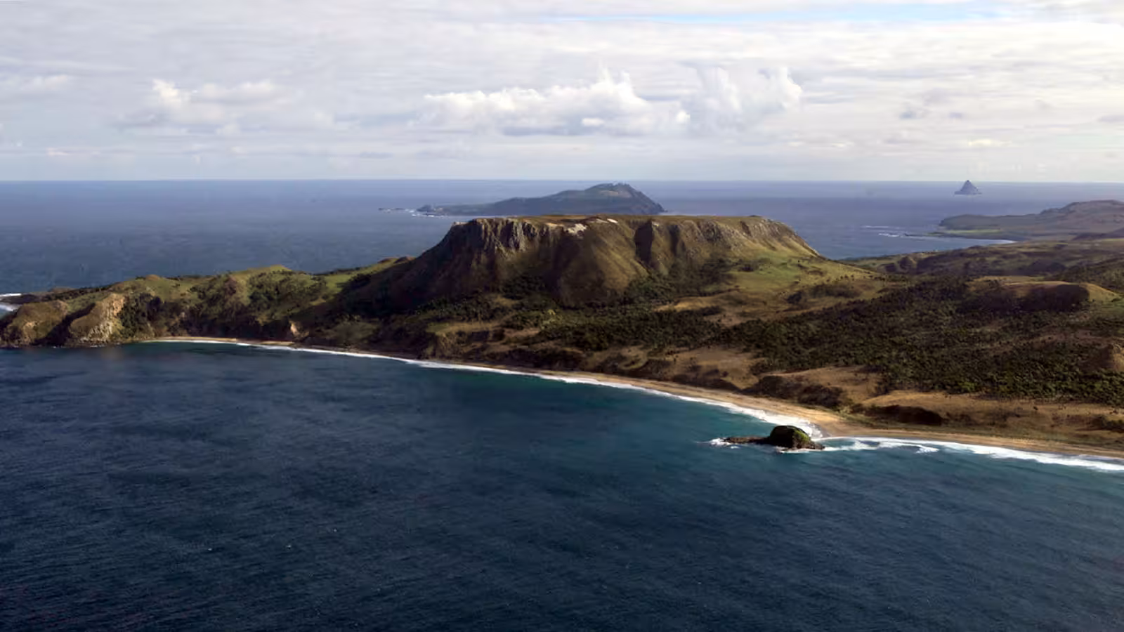 A photo of an island in the sea taken from the air