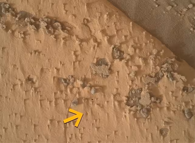 One Of The Unusual Holes Spotted By Nasa's Curiosity Rover On Mars, Measuring Approximately 1 Centimeter (0.4 Inches) Across.