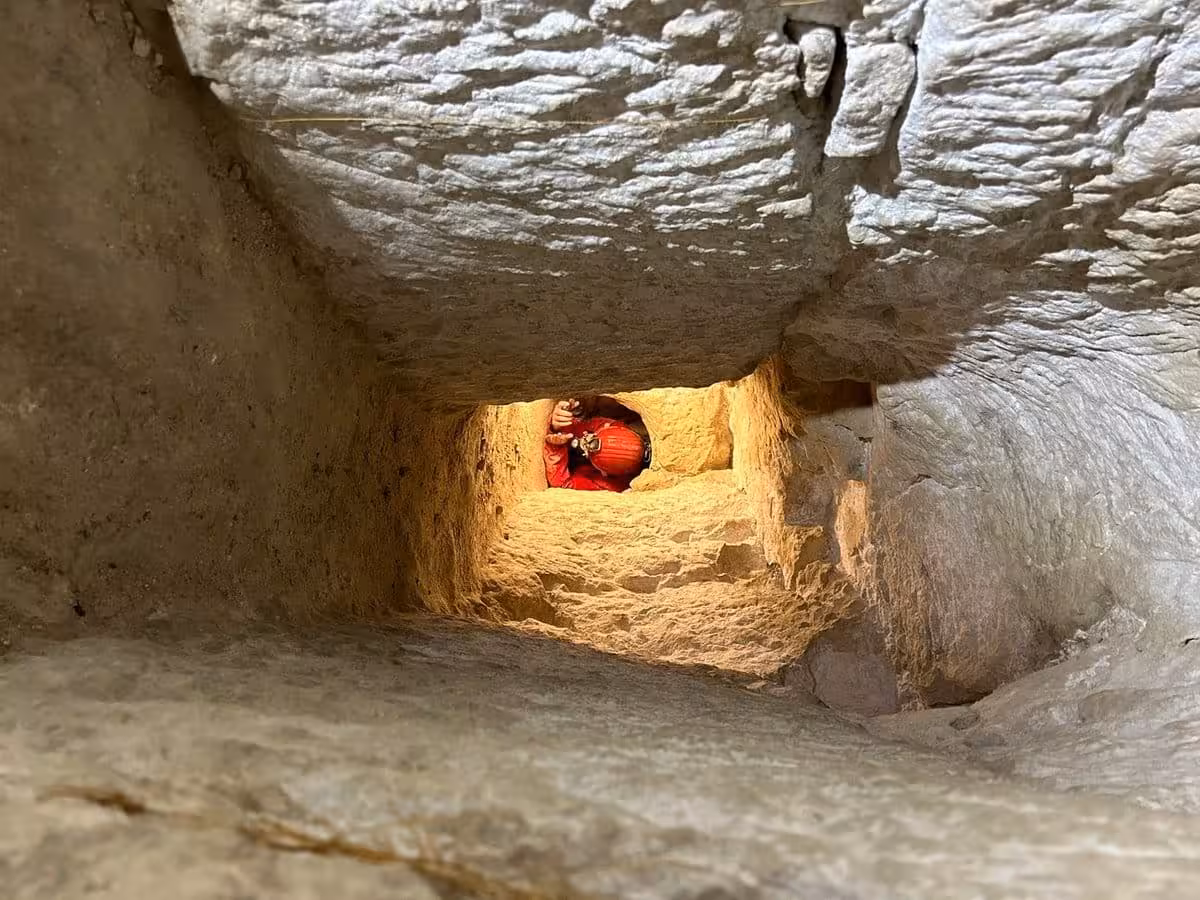 Luc Stevens Crawls Through A Narrow Passage Inside An Underground Tunnel, Showing Just How Cramped These Ancient Structures Can Be.