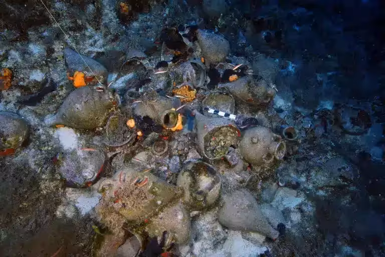 Ancient Pottery Vessels Lie Across The Seabed.