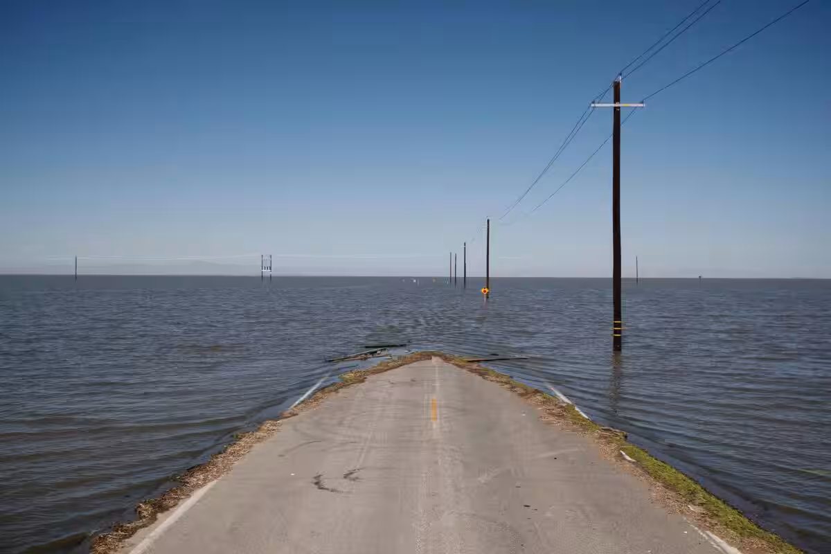 Floodwaters Rise In Tulare Lake Basin, Engulfing A Road In Helm Corner