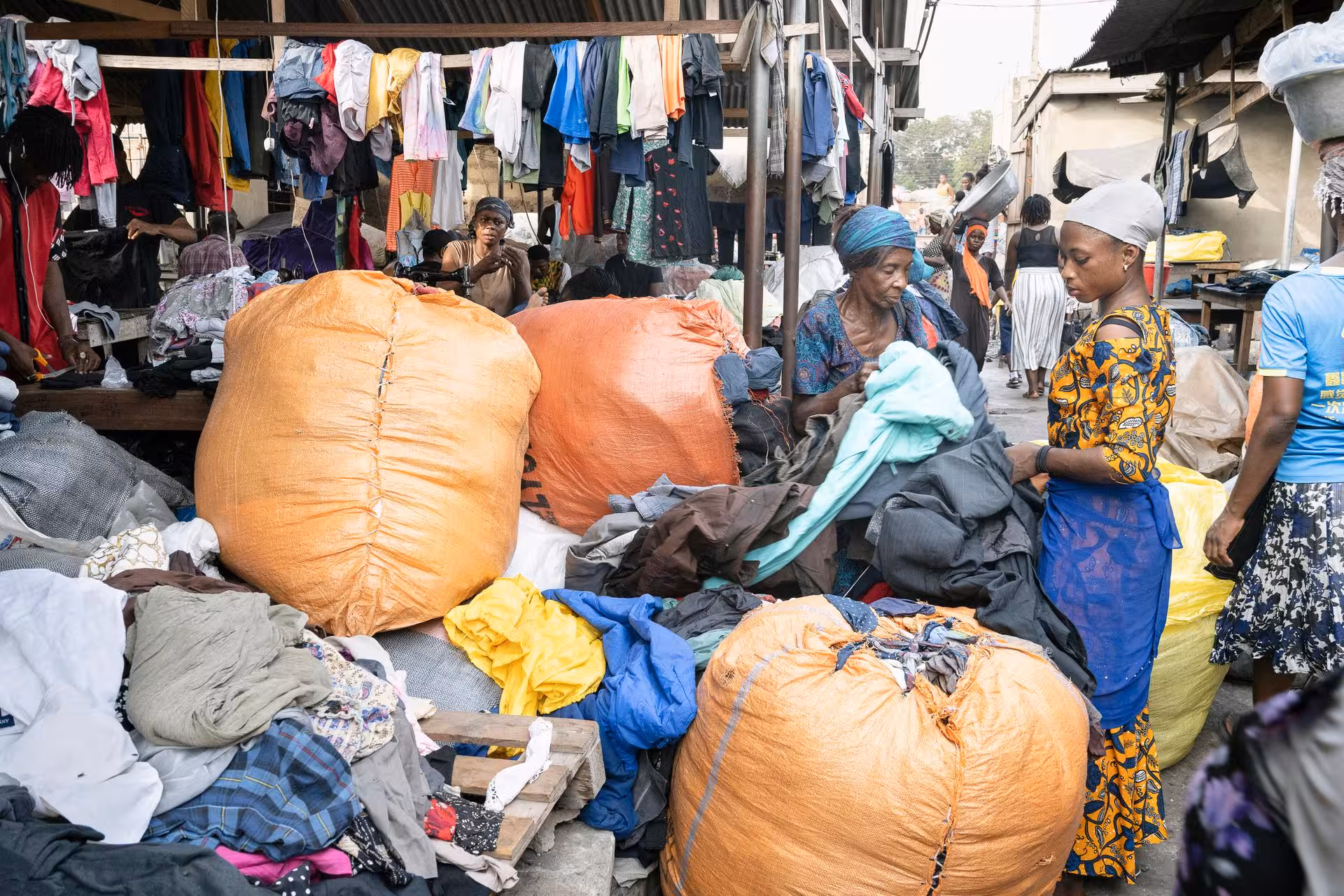 Bales of unsorted used clothes pile up on the edge of the Kantamanto market in Accra, Ghana, February 22, 2023.