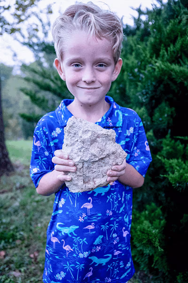 Leo Youngdahl Holds The Rare Fossil He Discovered
