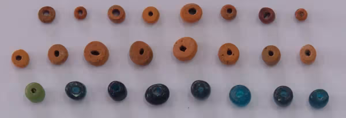 Ancient Glass Beads Discovered Among The Remains.