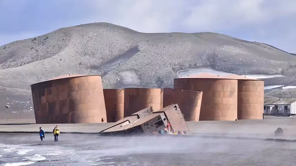 Large Digesters From The Norwegian Aktieselskabet Hektor Whaling Station Still Lie On The Steaming Beach At Whalers Bay