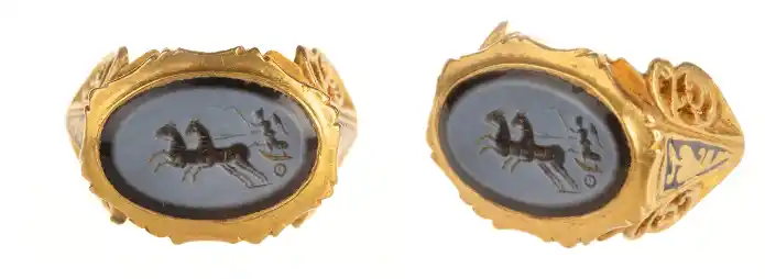 The Ilminster Ring Features An Engraved Nicolo Gem Depicting Victory, The Roman Goddess Of Triumph, Driving A Two Horse Chariot.