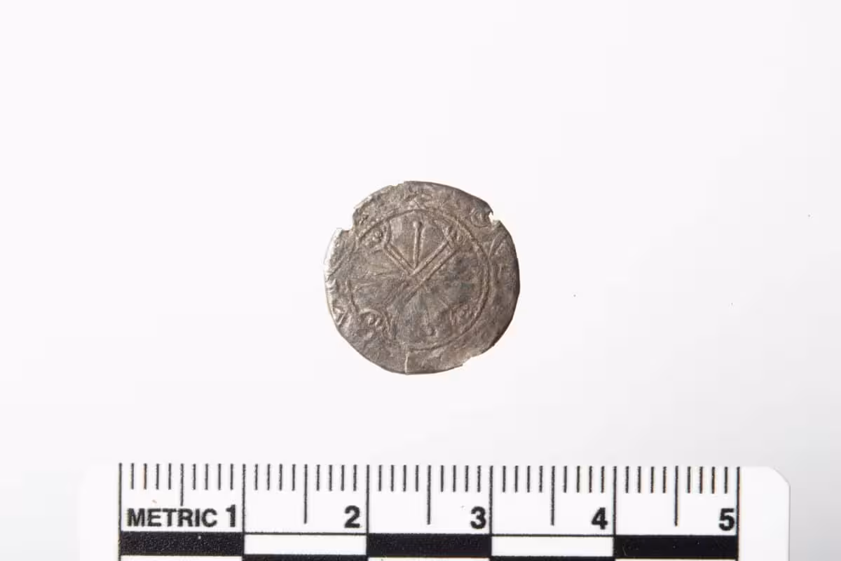 On The Back, The Copper Plate Is Clearly Visible, Along With The Coin's Edge Bent Around It.