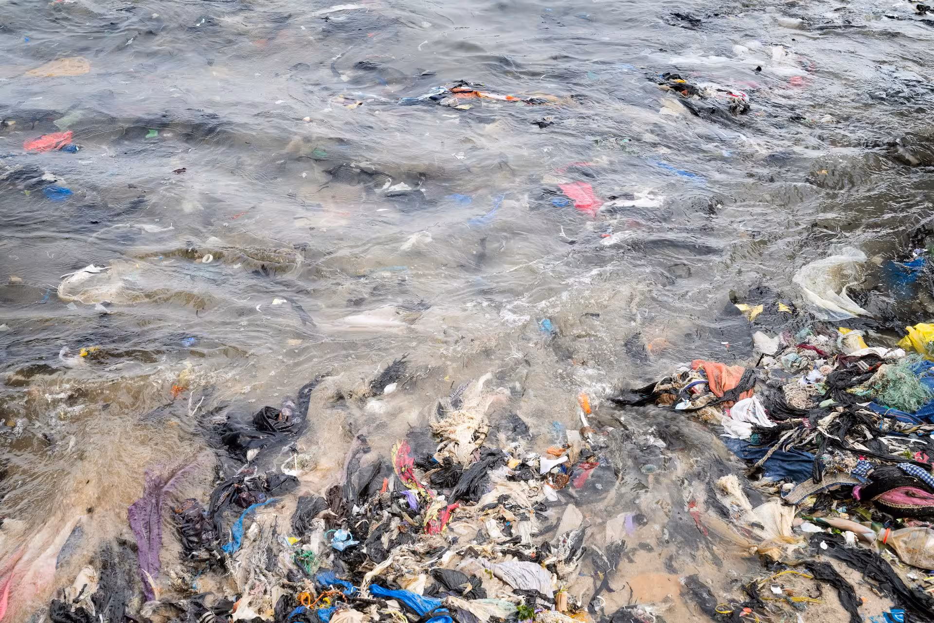 Clothes pollute the city's beaches and the sea, in Accra (Ghana), February 22, 2023.