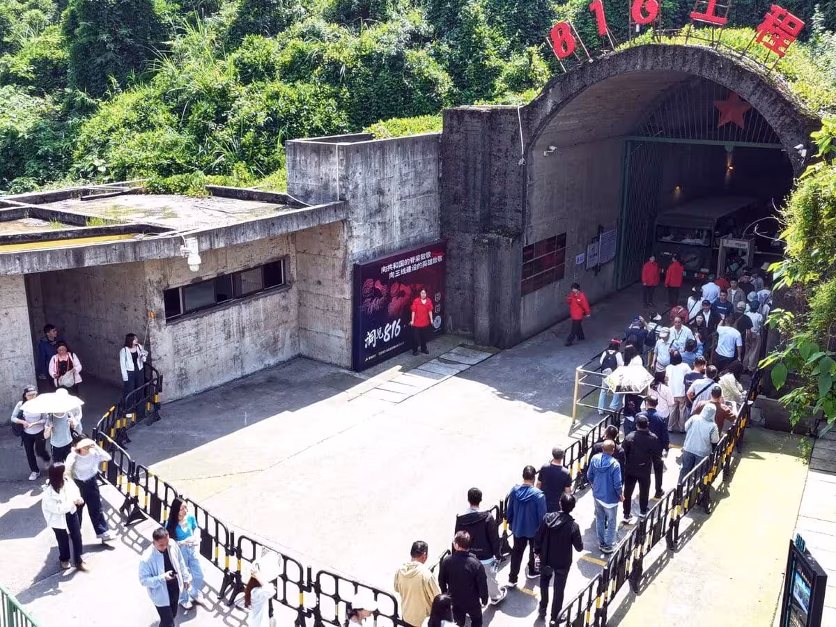 Tourists Wait In Line At The Entrance Of The 816 Project Scenic Area In April 2026