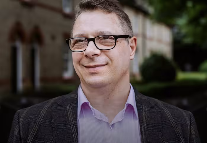 Dr. Melvin Vopson of the University of Portsmouth's School of Mathematics and Physics.