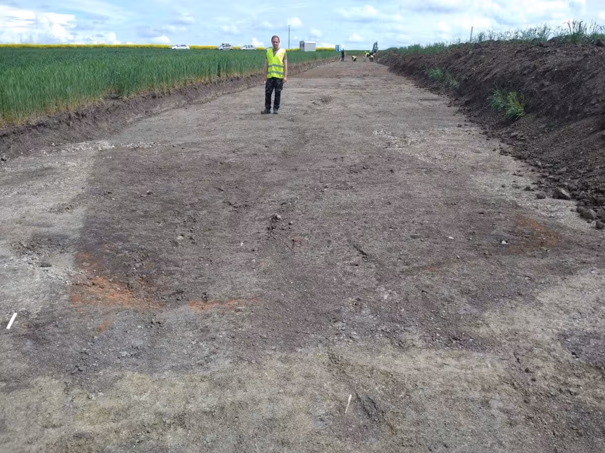 Excavation Director Bartosz Adamski Beside A Medieval Cellar Pit.