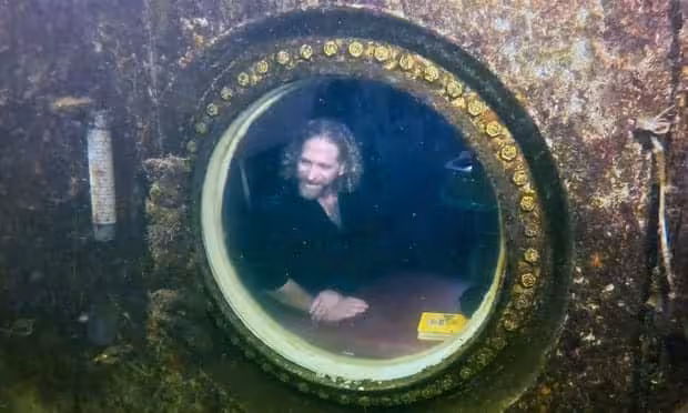 Joseph Dituri Is Seen Inside A Small Underwater Habitat.