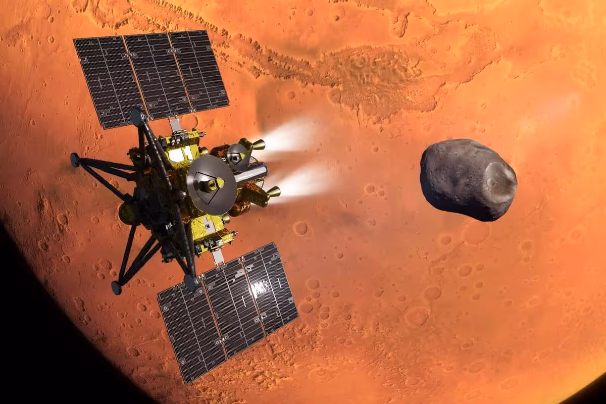 Artist’s Impression Of Jaxa’s Mmx Spacecraft Entering Mars Orbit, With Phobos In The Background.