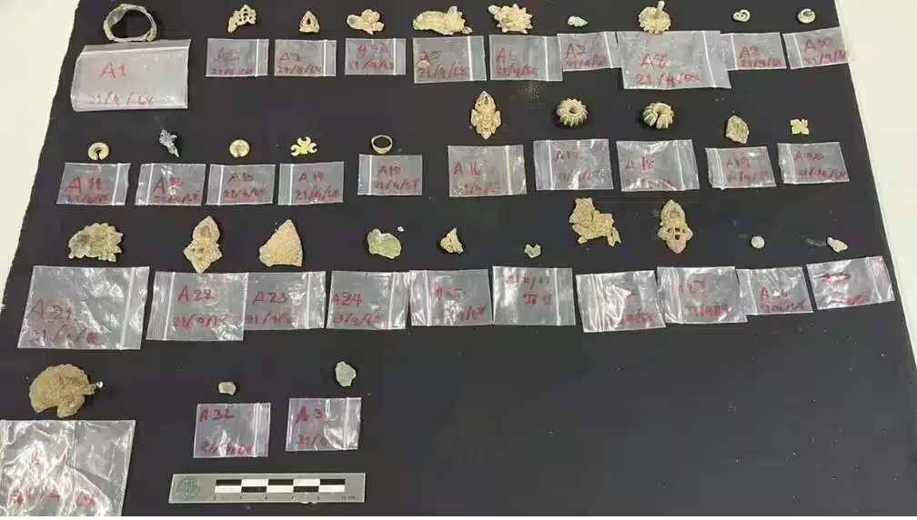 Ancient Gold, Silver, And Bronze Ornaments Discovered Inside A Ceramic Container Beneath The Wat Thammachak Sema Ram Temple Complex In Thailand.