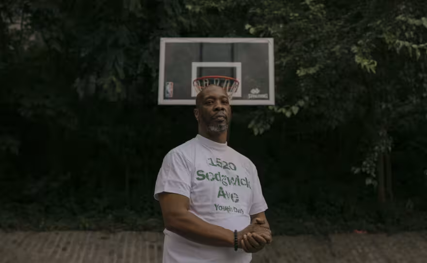 Jerry Leader, a resident of 1520 Sedgwick Avenue during his youth, stands for a portrait at a basketball court outside of 1600 Sedgwick Avenue — a park where DJ Kool Herc would often lead early hip-hop parties.