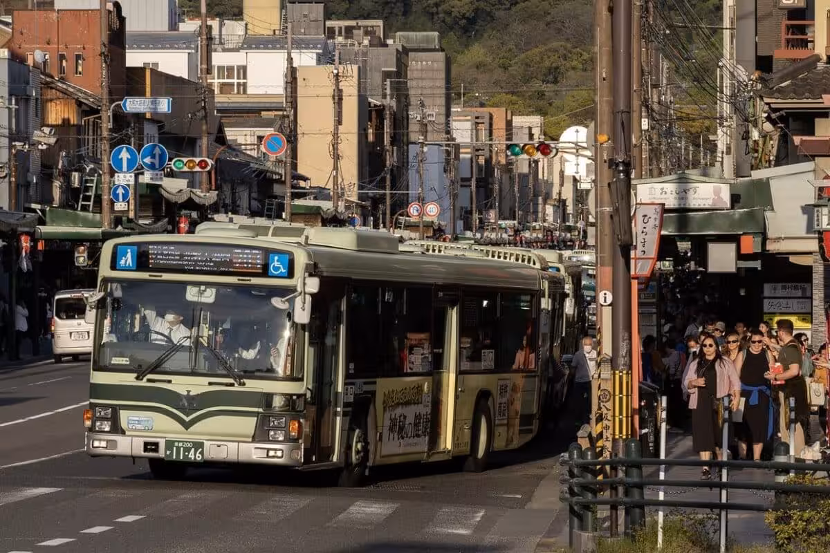 A City Bus Drives Along A Street In Kyoto, Japan, On Saturday, April 13, 2024