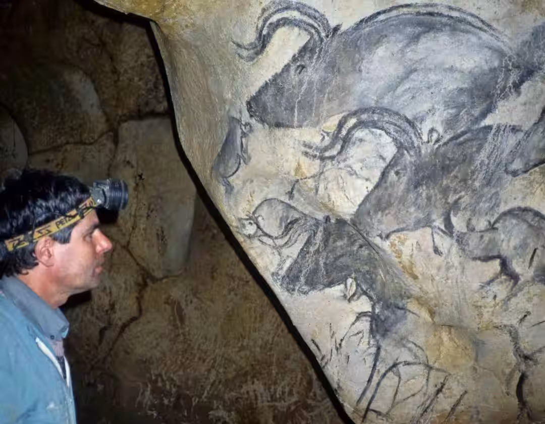 Inside The Cave, A Scientist Observes Ancient Drawings
