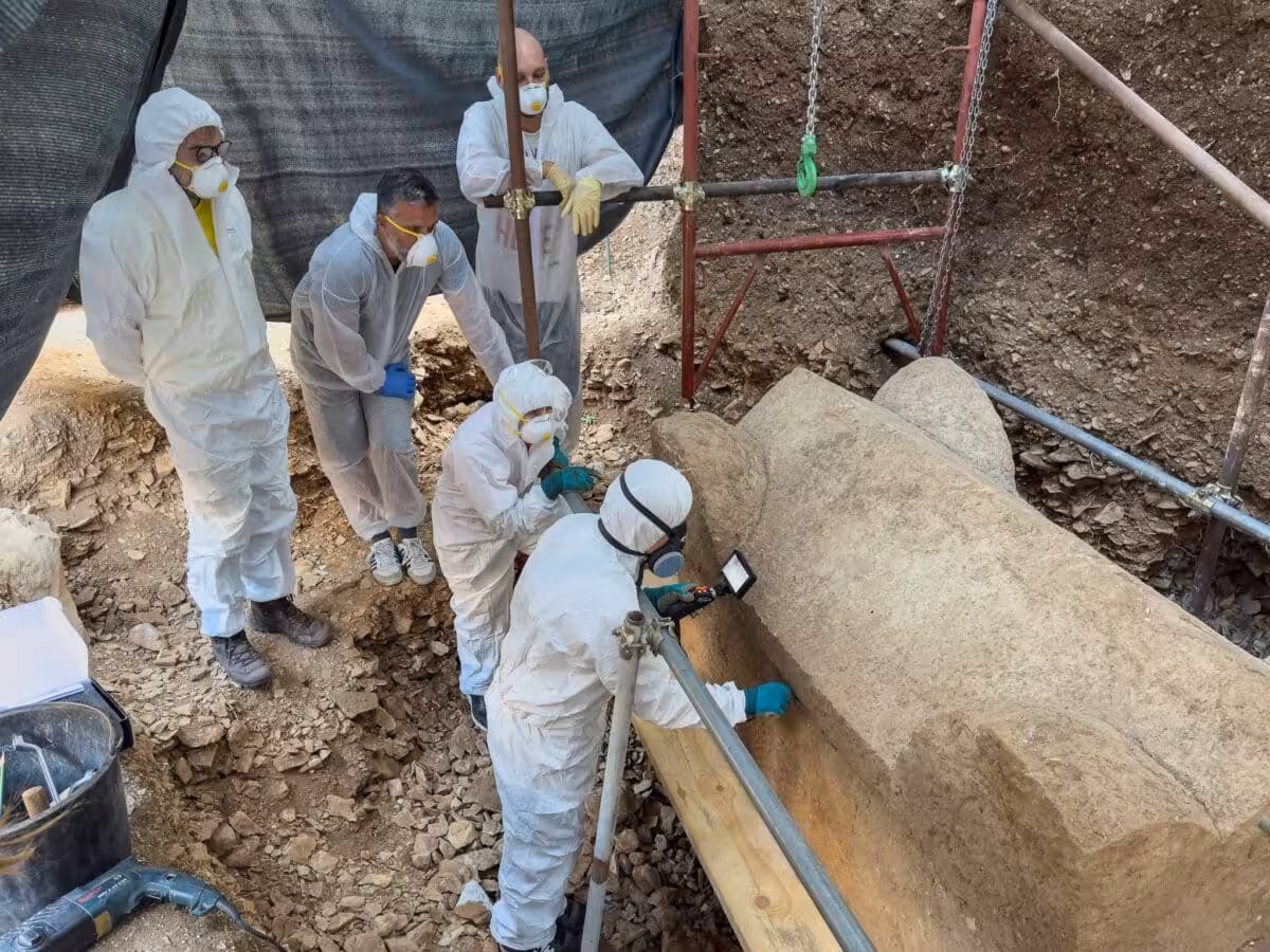 Specialists Examine The Intact Roman Sarcophagus During Excavation.