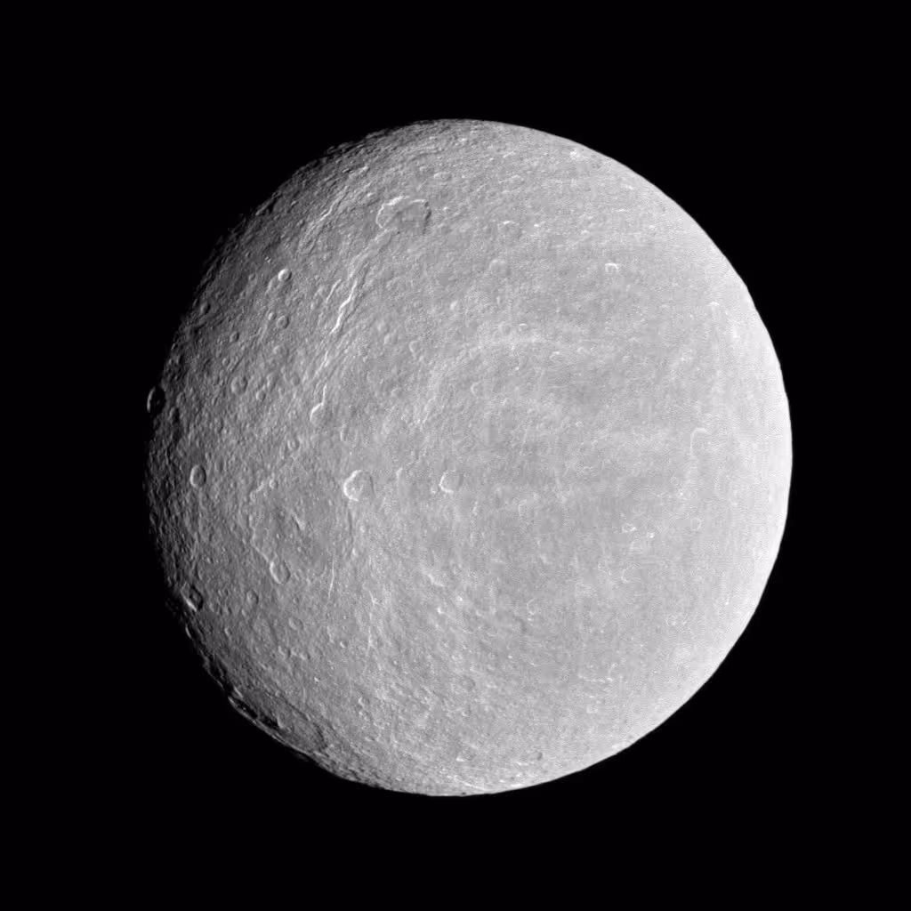Cassini View Of Rhea’s Heavily Cratered Surface.