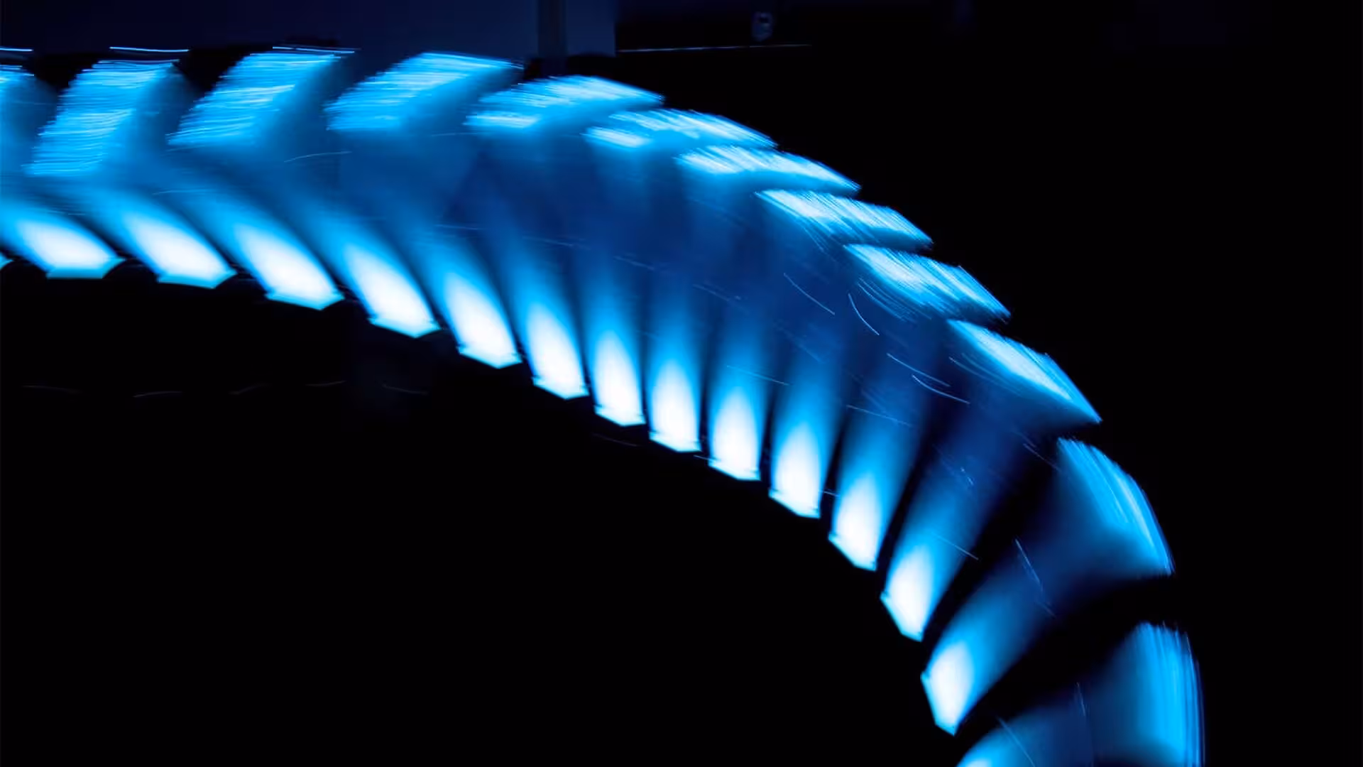 Blue sections form a column that bends on a black background.