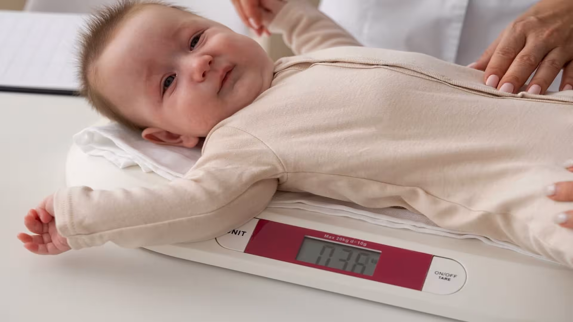 High angle baby on weighing machine.