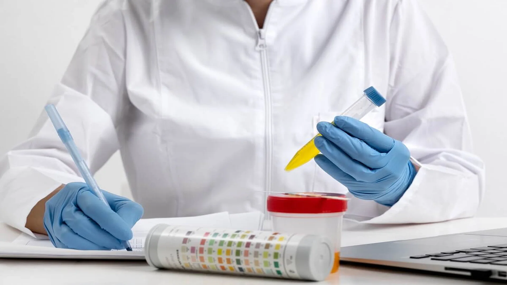 Free photo lab doctor performing medical exam of urine.
