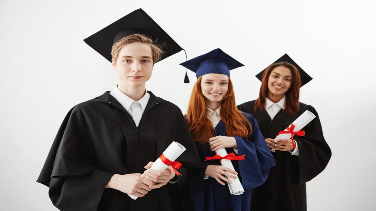 Free photo three happy international university graduates smiling rejoicing holding diplomas.