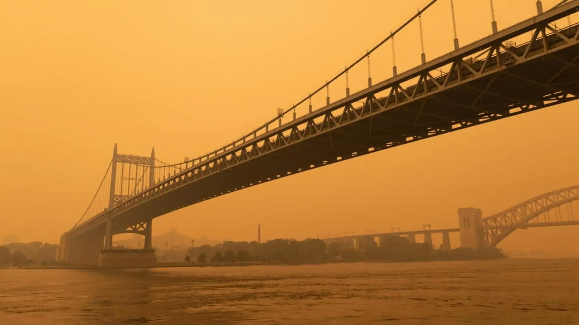 The Triborough Bridge Along The East River In New York With Massive Air Pollution Caused By Wildfires Scaled