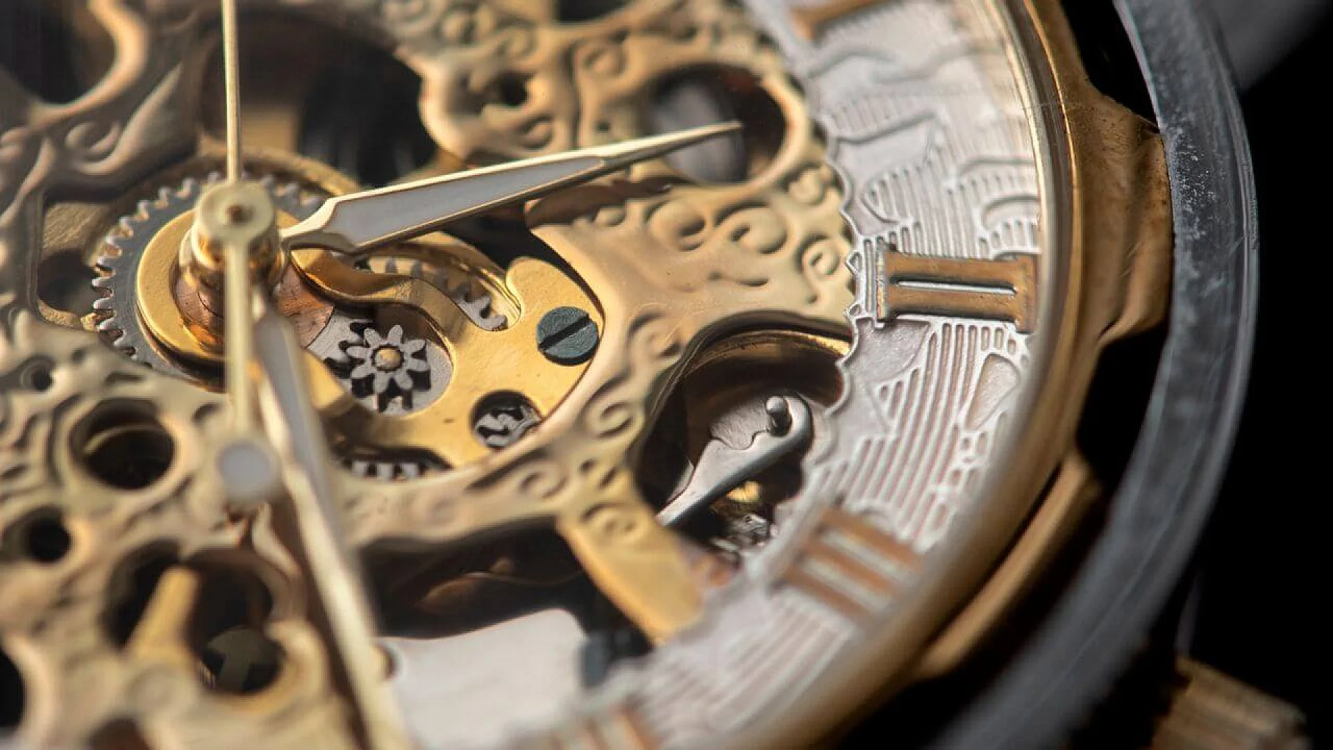 Extreme close-up of a golden skeletonized watch movement with visible gears and hands, contrasting traditional mechanical timekeeping with the new quantum watch concept