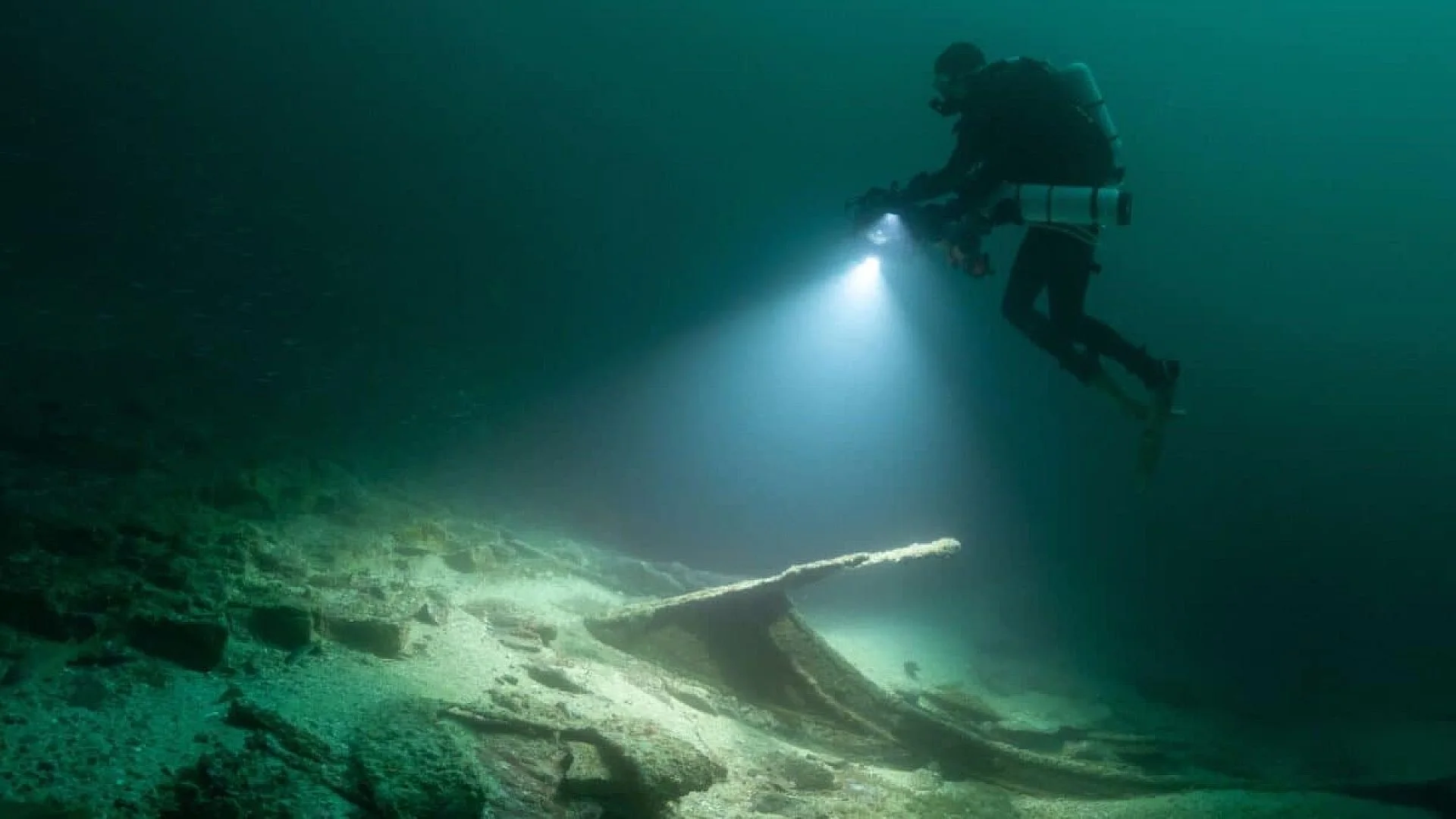 Divers Pulled A Tiny Figurine From An Italian Lake After Years Underwater Its Creators Fingerprints Are Still Visible Scaled