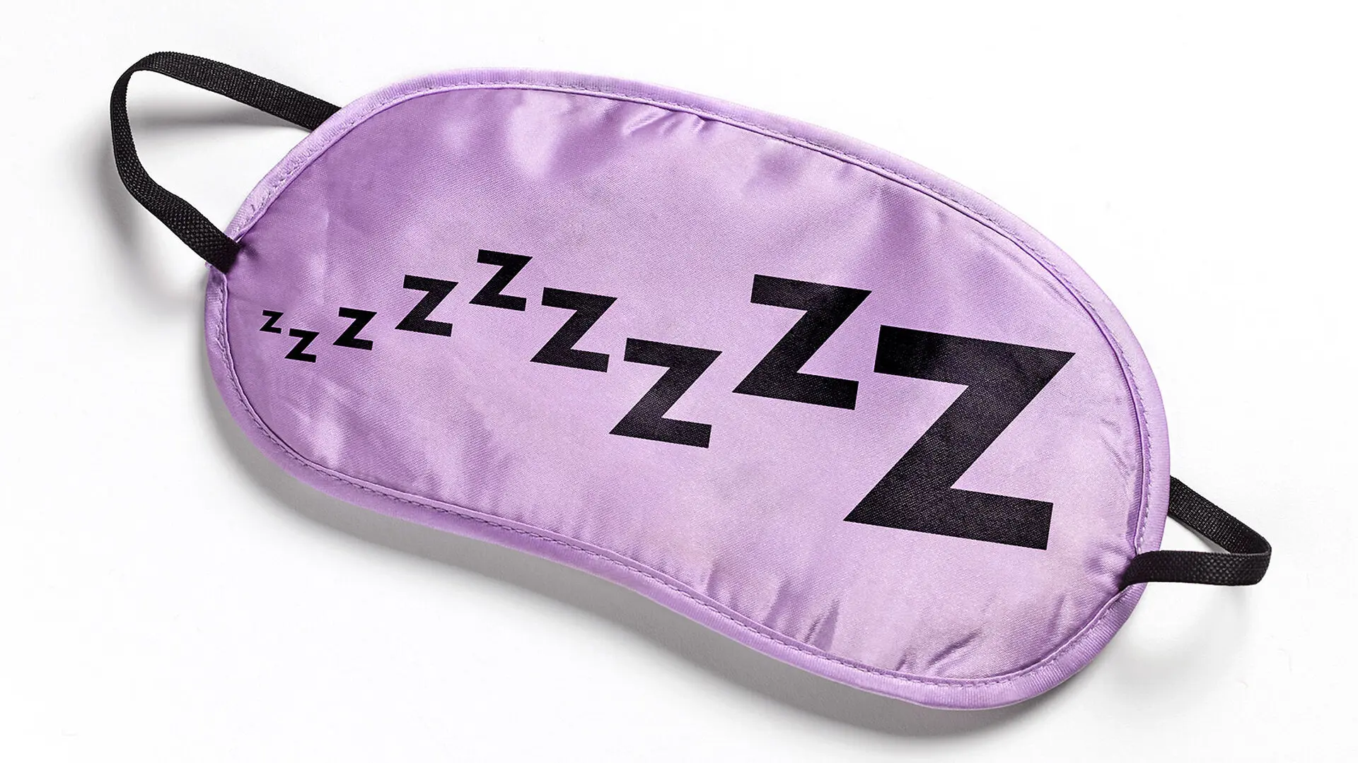 A purple sleep mask covered in Z
