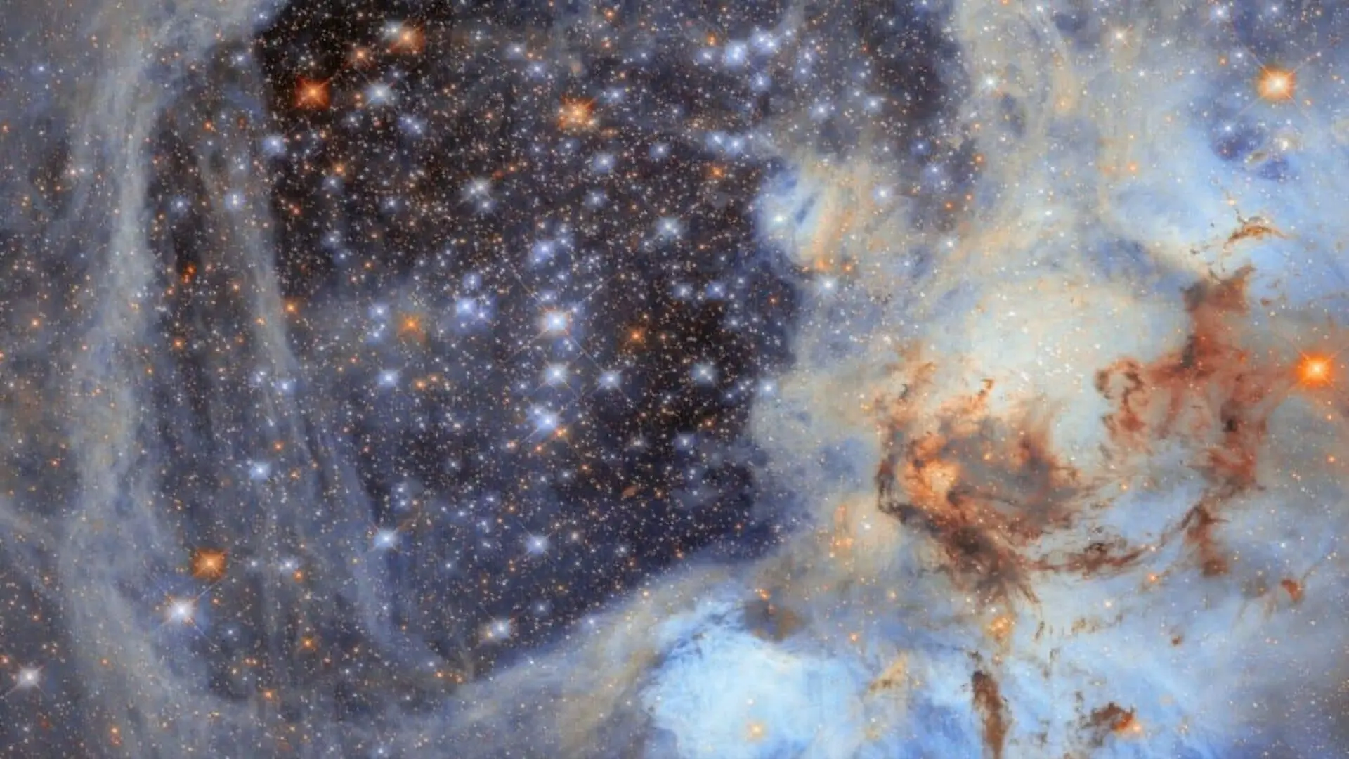 Hubble Captures A Massive Cosmic Void Carved By Star Explosions Light Years Away Scaled
