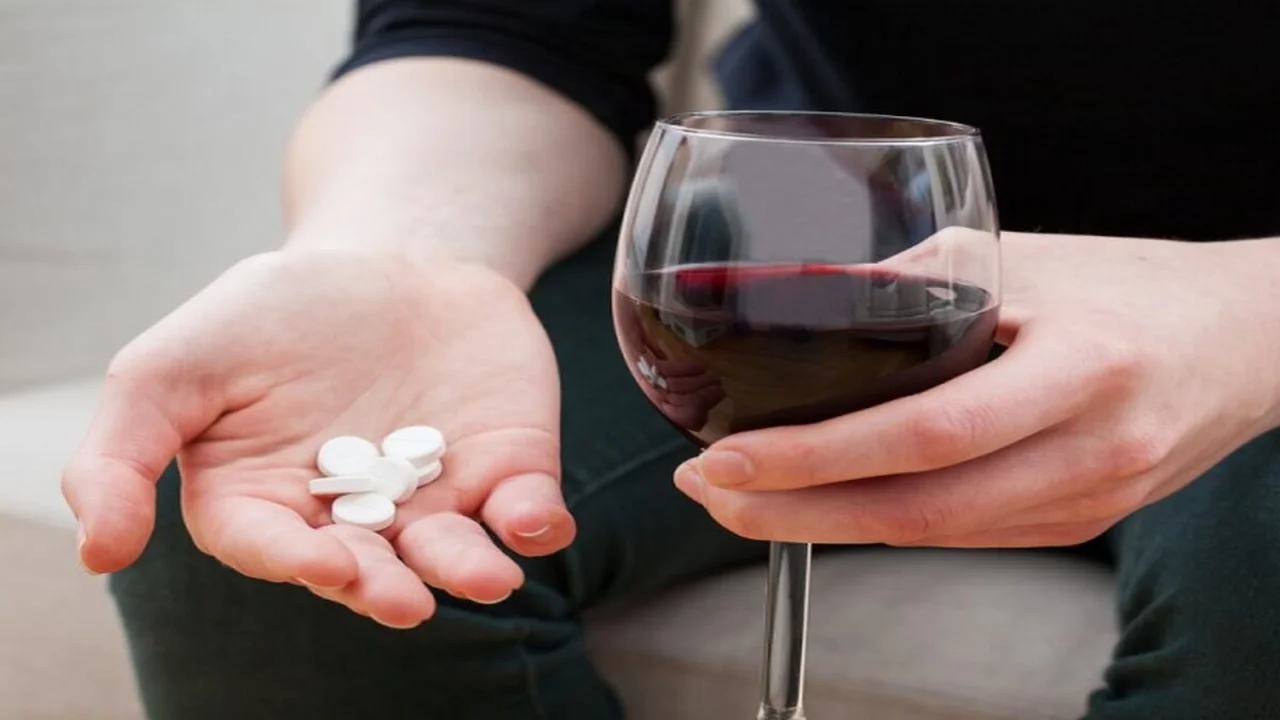 Woman trying to kill pain with pills and alcohol.