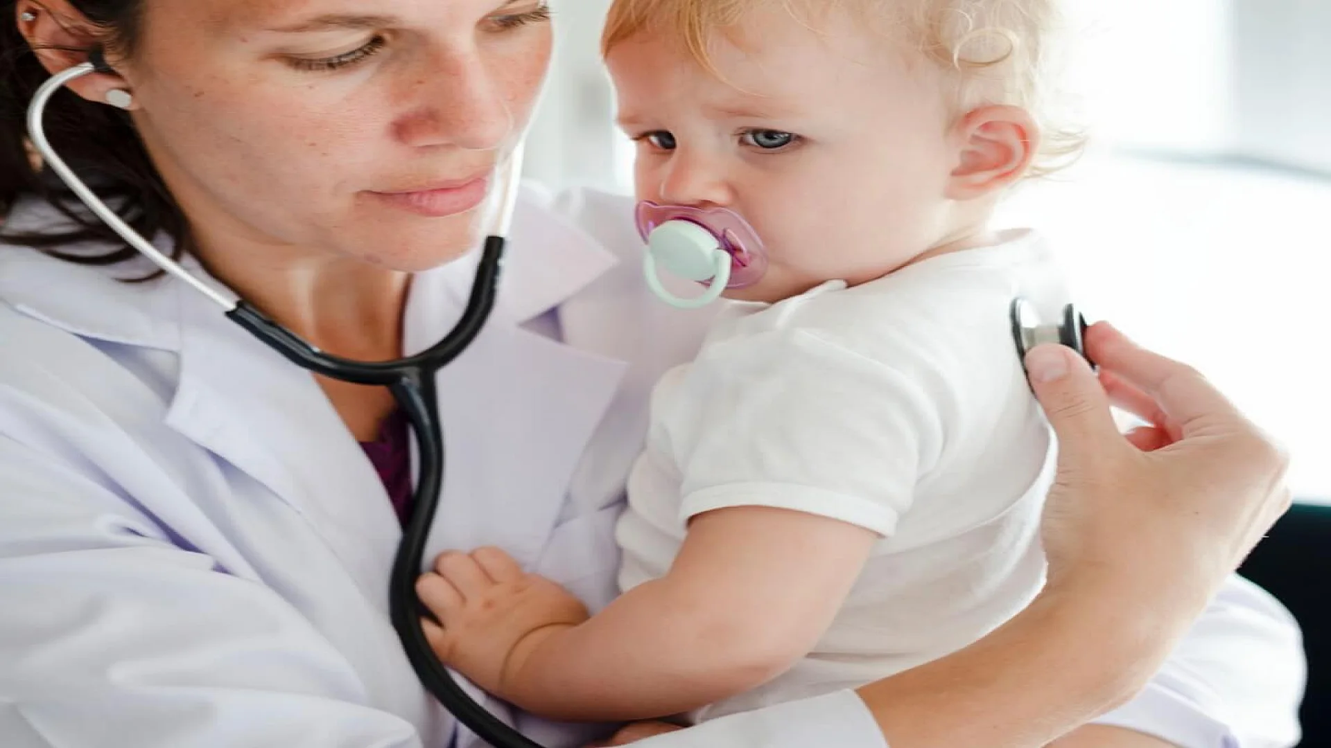 Doctor Checking Baby With Stethoscope