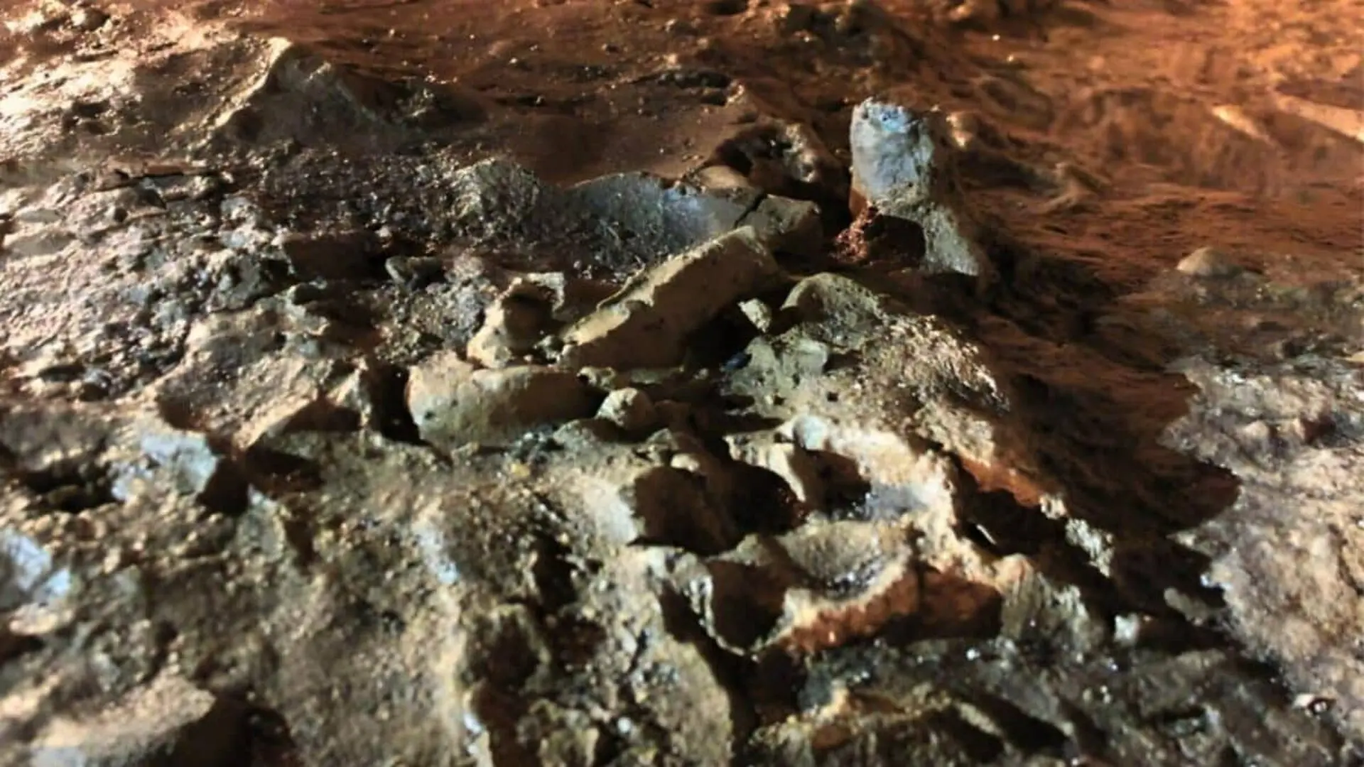 A Torchlit Cave Trail Left By A Family Years Ago