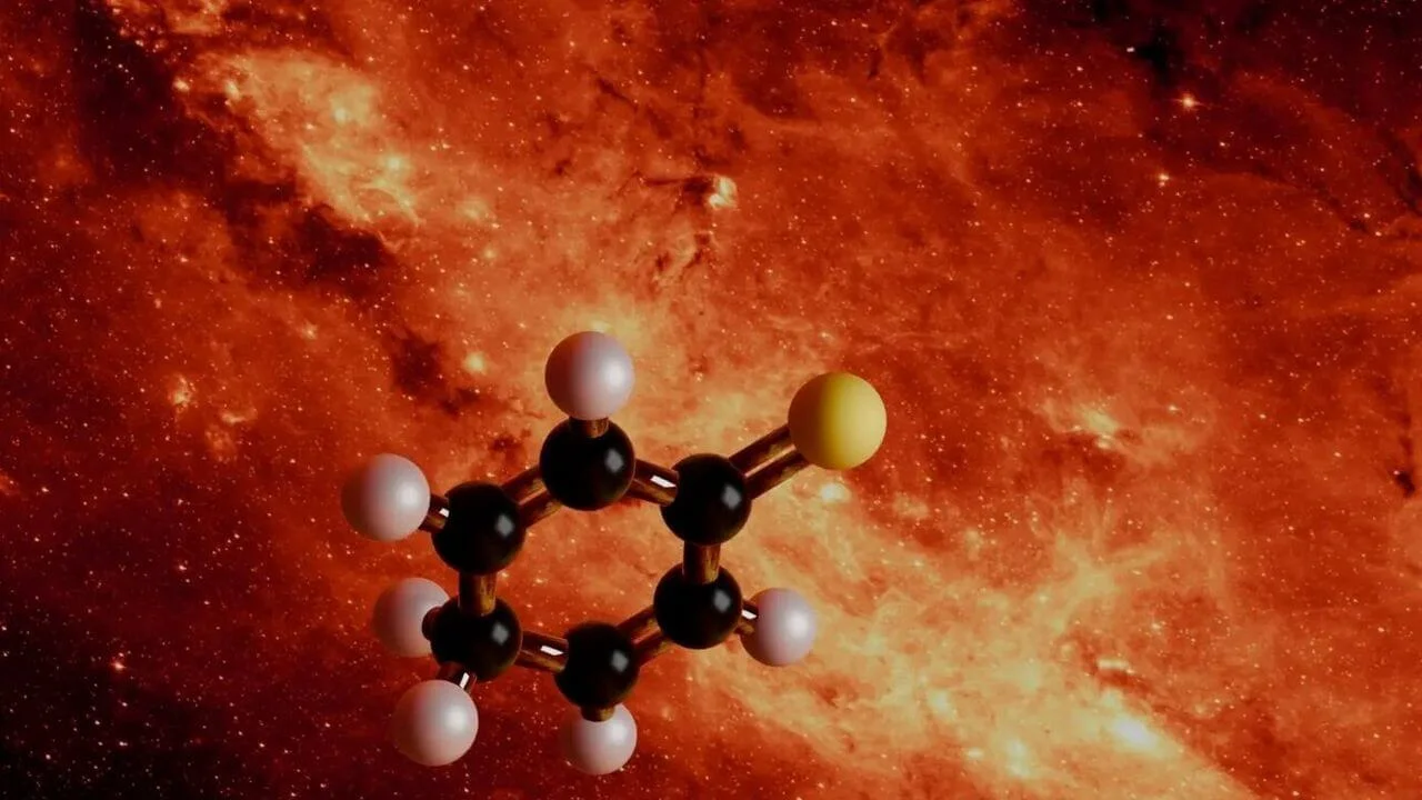 A ball-and-stick molecular model of 2,5-cyclohexadien-1-thione, featuring a hexagonal ring of black carbon atoms and a single yellow sulfur atom, superimposed against a glowing orange and red cosmic nebula.
