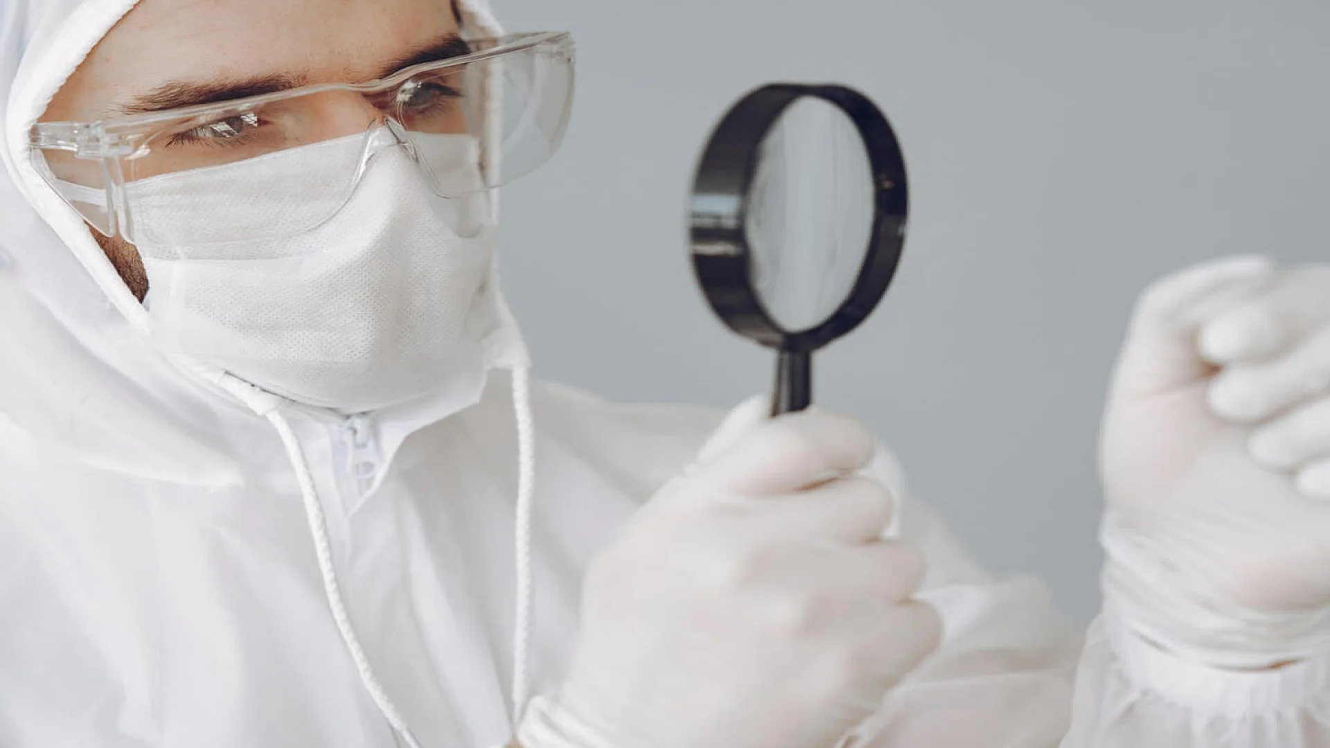 Forensic Scientist Investigating Blood Spatter Shapes
