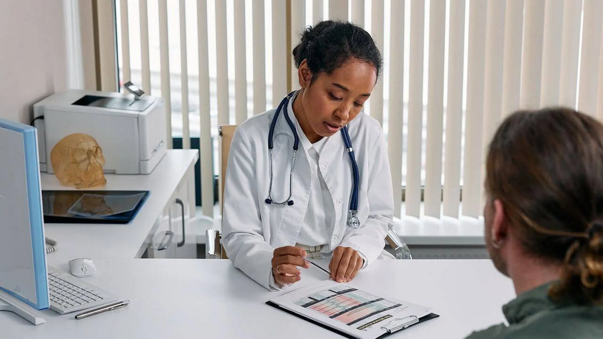 A doctor uses data to guide patient care, a process that is evolving with the integration of artificial intelligence