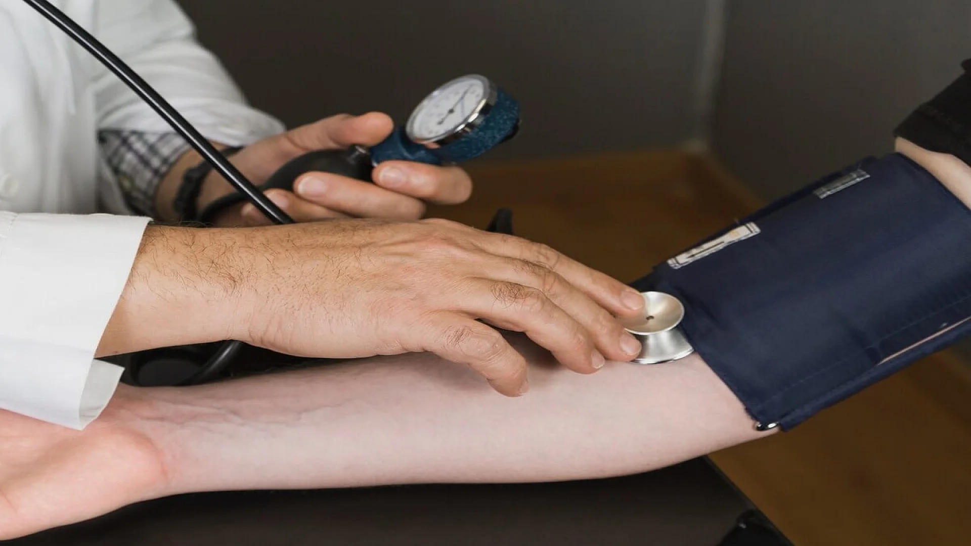 Doctor Measuring Blood Pressure
