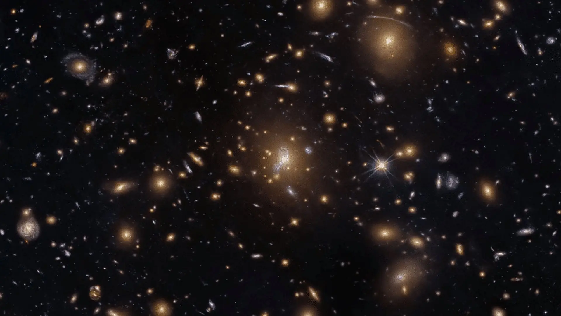 Hubble Captures A Cosmic Swarm That Is Bending Light Across The Universe Scaled
