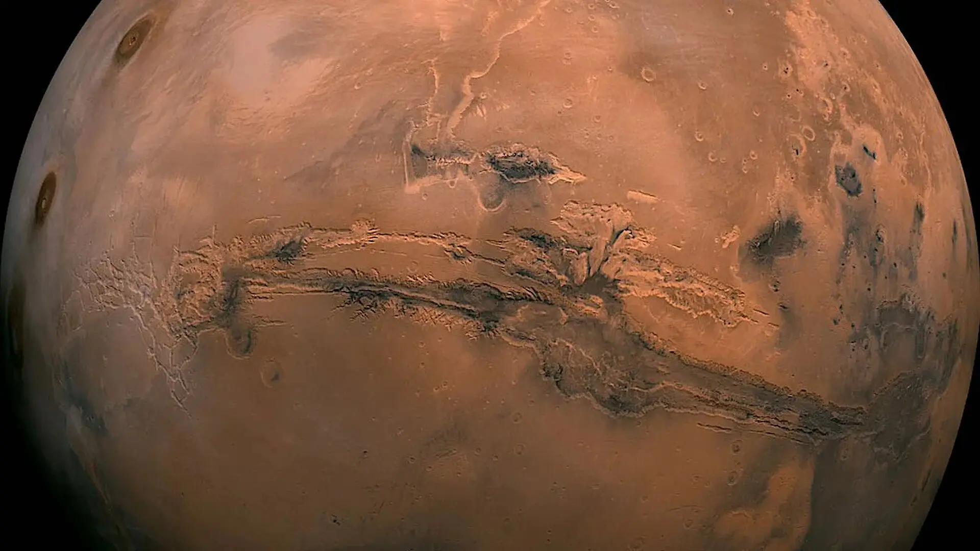Orbital evidence points to an eroded volcano near Mars’ equator, where buried glacier ice may survive beneath volcanic deposits. (CREDIT: NASA)