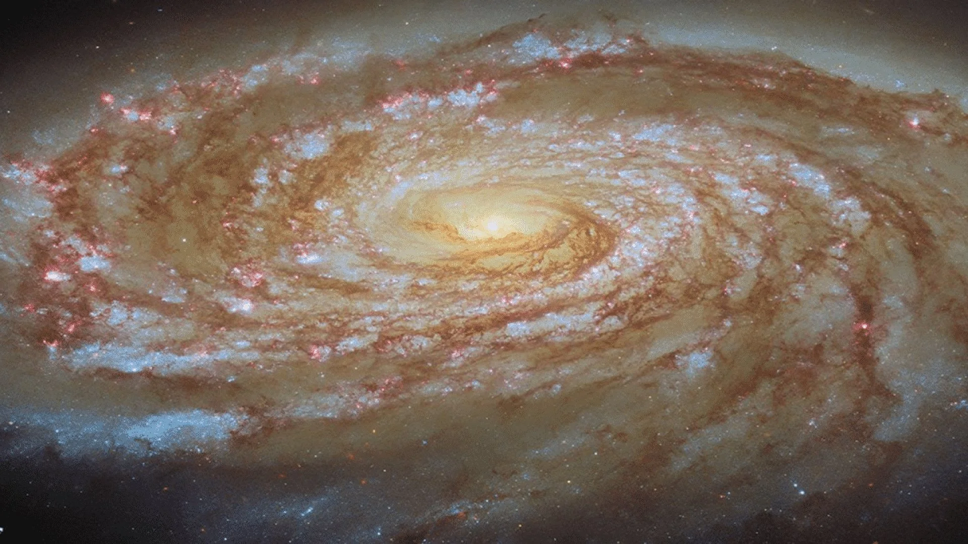 Hubble Reveals A Giant Spiral Galaxy Racing Toward A Dramatic Fate Scaled