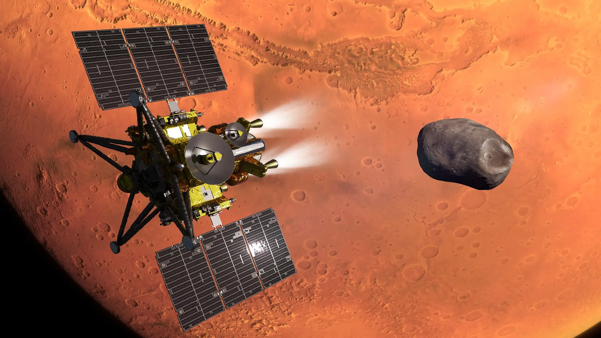 An artist’s concept of JAXA’s MMX spacecraft during its Mars’ orbit insertion. The Martian moon Phobos, which MMX will explore and sample, is in the background. (CREDIT: JAXA)
