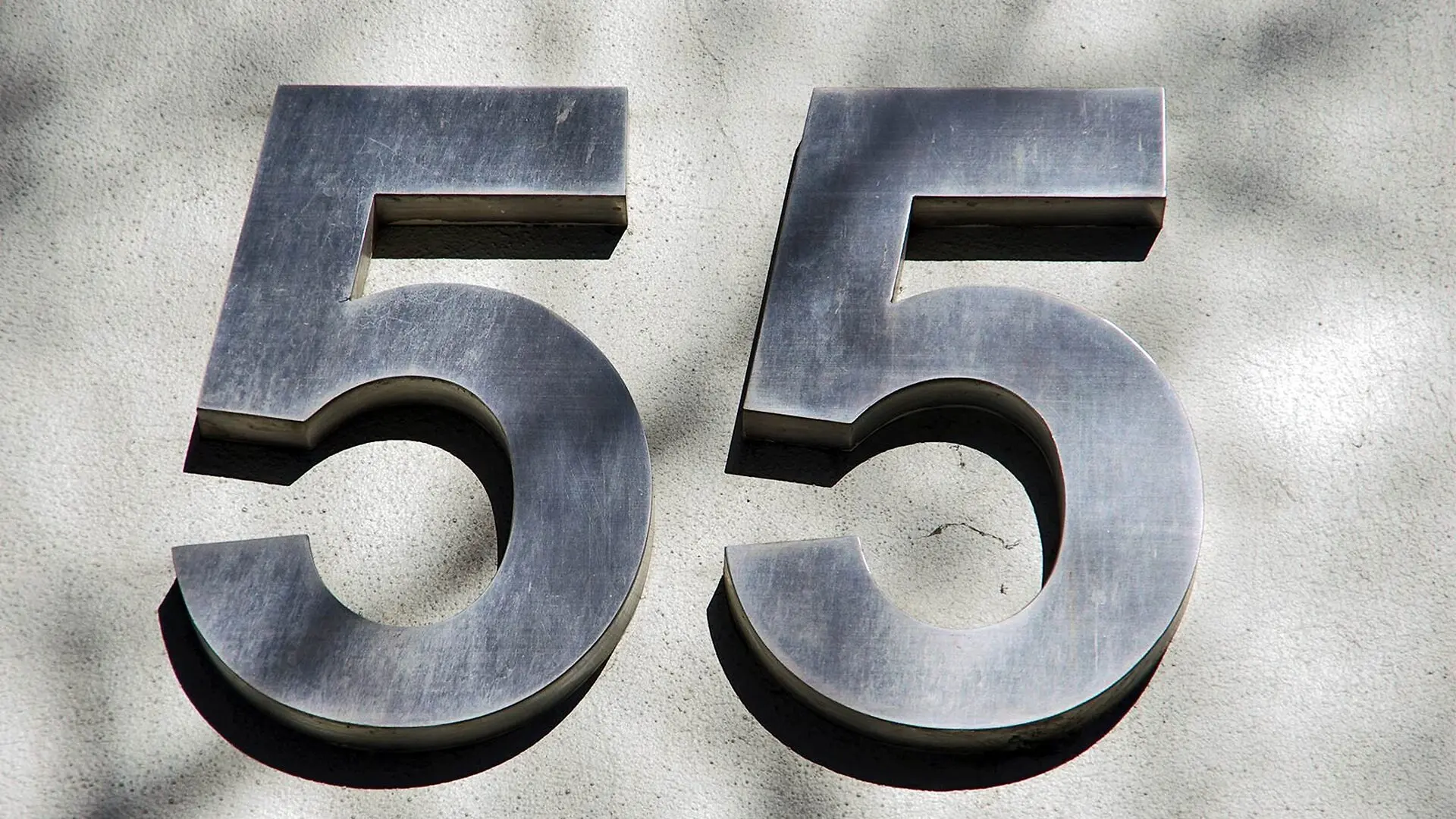The number 55 appears on the front of a building.