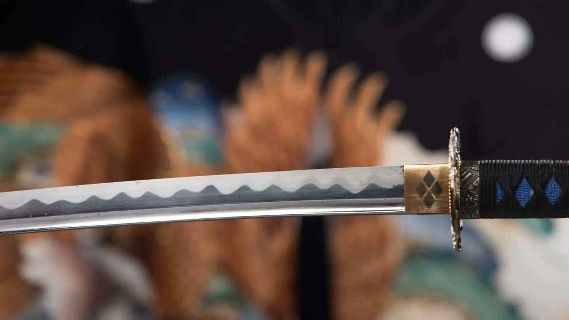 Japanese Samurai Katana Sword Suspended In Mid Air Against A Blurred Kimono Background Scaled