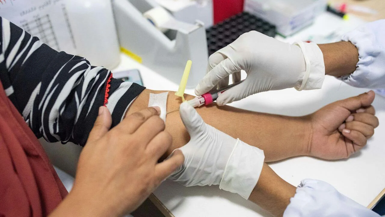 Medical Professional Drawing Blood from Patient’s Arm