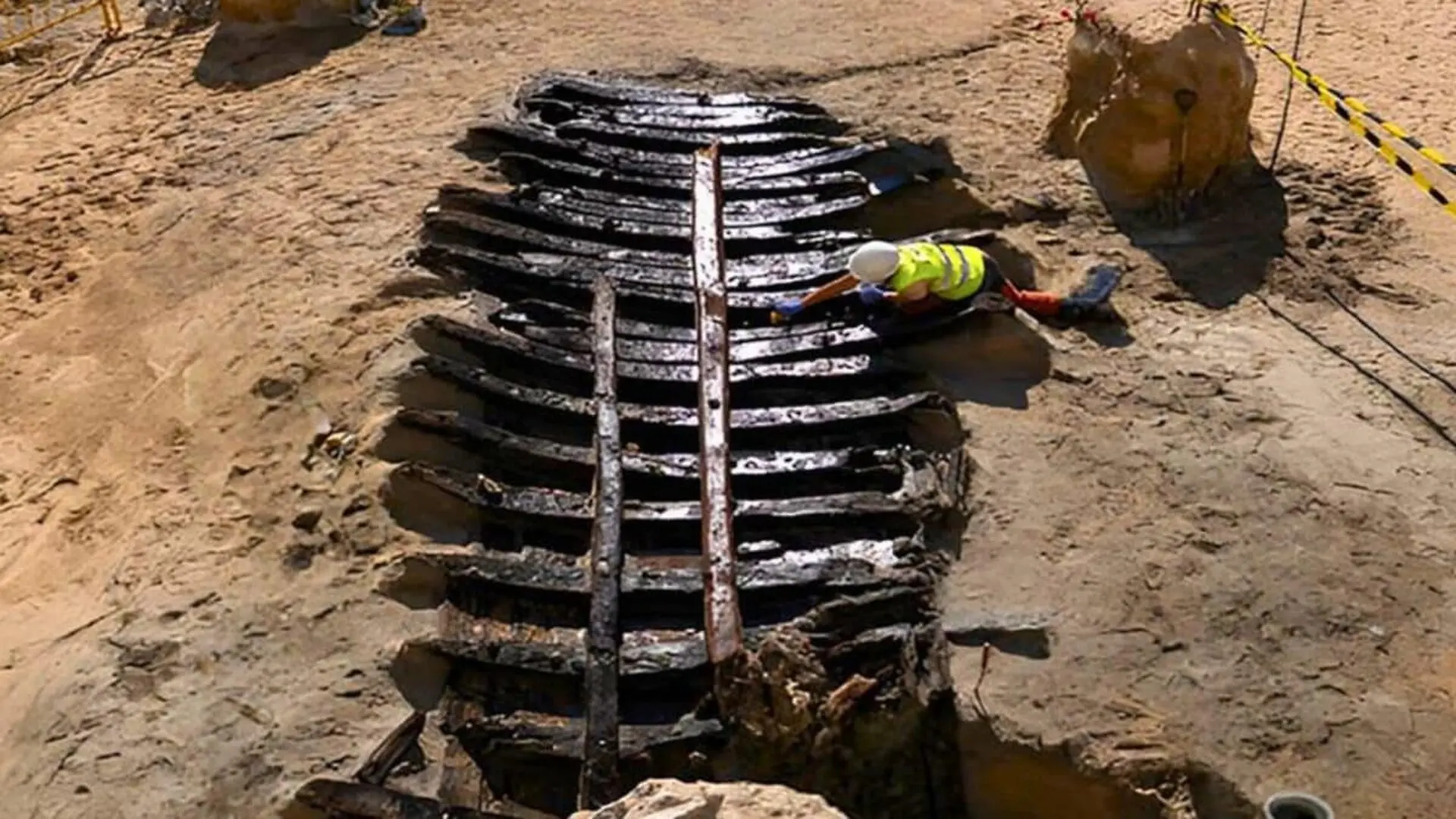 Thirty Curved Wooden Ribs Emerged From The Sand Beneath Barcelona Scaled