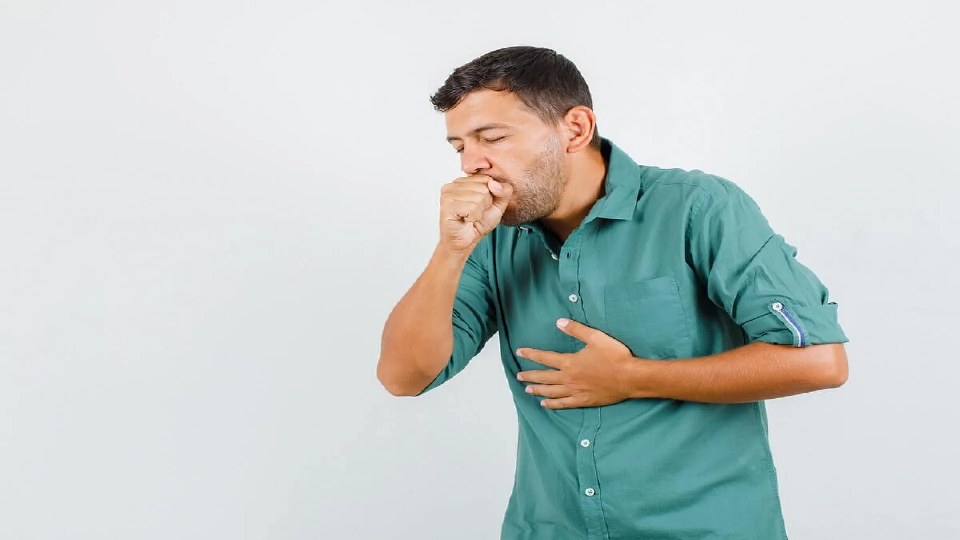 Free photo young man suffering from cough in shirt and looking ill.